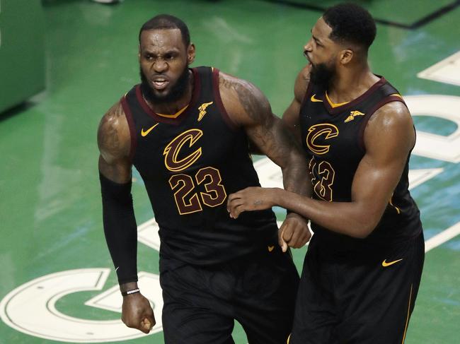 Cleveland Cavaliers forward LeBron James and center Tristan Thompson (13) celebrate near the end of the second half in Game 7 of the NBA basketball Eastern Conference finals, Sunday, May 27, 2018, in Boston. (AP Photo/Charles Krupa)