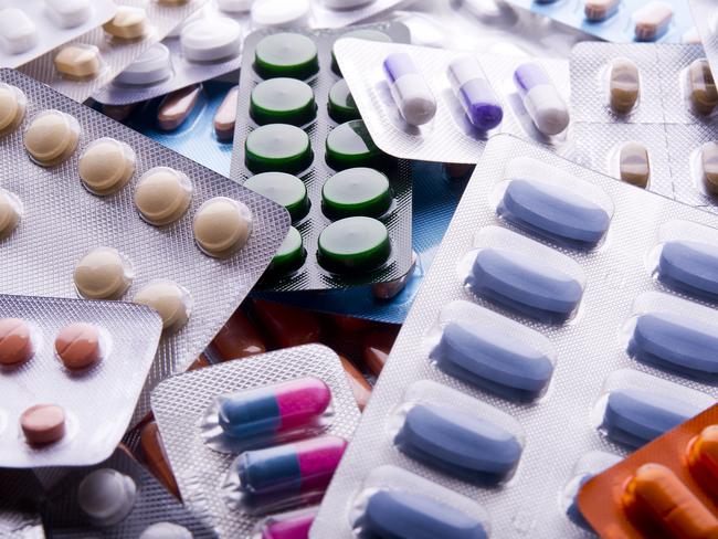 Close up of packs of pills and capsules.