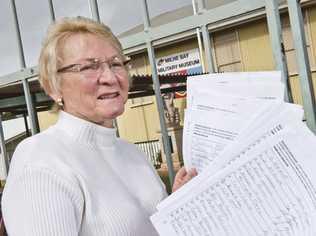 SUPPORTERS SIGN: Milne Bay Military Museum president Marian Jones with many signatures to save the museum. Thursday, 5th Jul, 2018. Picture: Nev Madsen