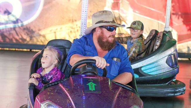 Chris and Cadence Bonney enjoying the third and final day of the Royal Darwin Show. Picture: Glenn Campbell