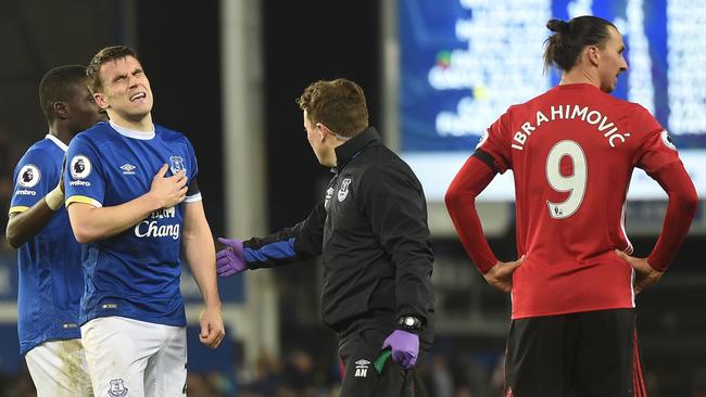 Everton's Irish defender Seamus Coleman (2nd L) reacts after a clash with striker Zlatan Ibrahimovic.