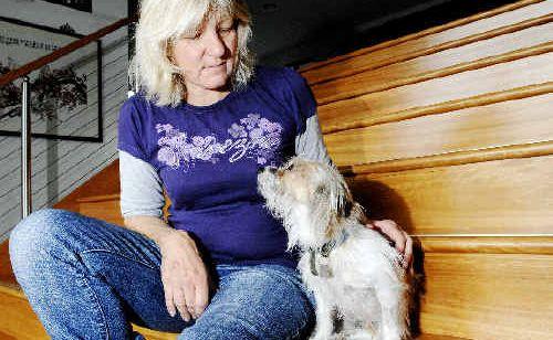 Lennox Head resident Pippa Crane with her dog Scruffy, who is on the mend after being badly mauled by two large dogs which attacked him on Sharpes Beach last Saturday. . Picture: Jay Cronan