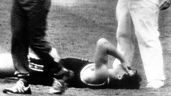 St Kilda’s Danny Frawley lies stunned after being hit behind the play in 1988