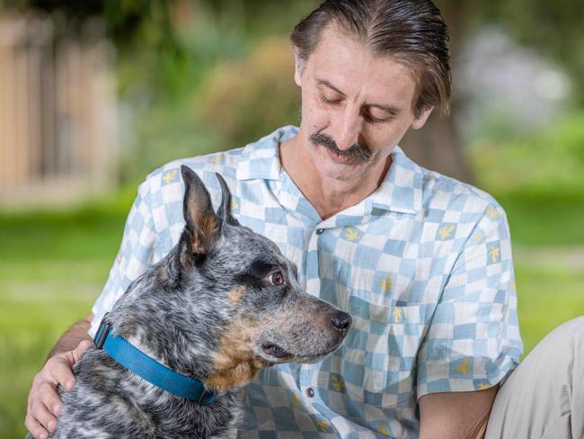 Kristian Kosh and his dog Buddy outside his Mitchell Park home. Pictured on 28th July 2023. Picture: Ben Clark