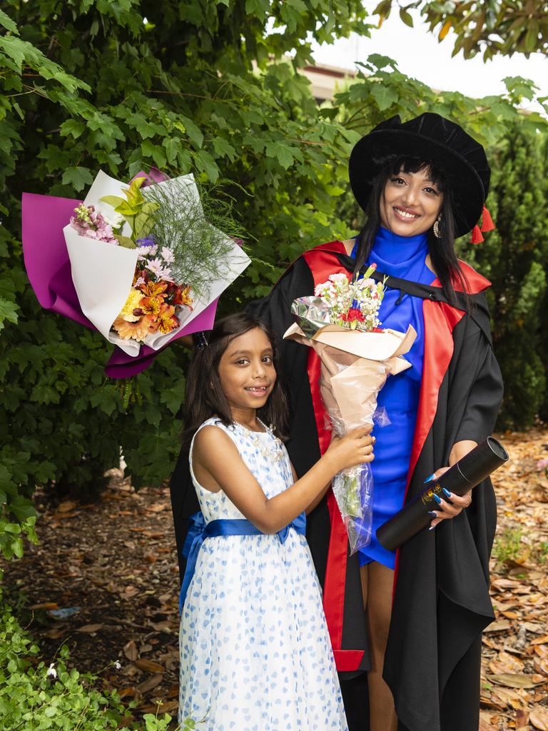 PhD graduate (chronic obstructive pulmonary disease) Hancy Issac with daughter Thea Arun at the UniSQ graduation ceremony at Empire Theatres, Tuesday, December 13, 2022.