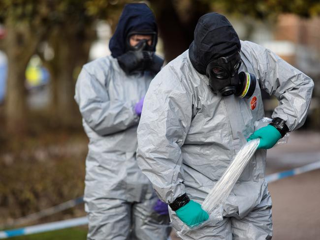 Police officers in protective suits and masks work near the scene where former double-agent Sergei Skripal and his daughter, Yulia were discovered. Picture: Getty