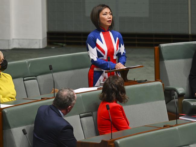 Dai Le delivering her maiden speech at Parliament House in Canberra in 2022 wearing a traditional Vietnamese áo dài dress fashioned from an Australian flag. Picture: Martin Ollman