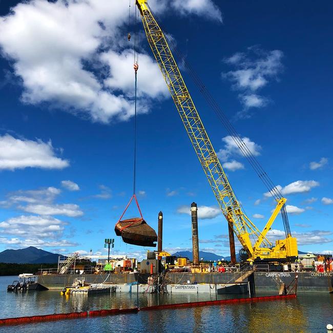 A crane has dredged up a hulking piece of the sunken Warunda fishing vessel from the Trinity Inlet floor as part of the Queensland Government's War on Wrecks. PICTURE: SUPPLIED