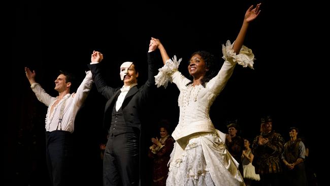 John Riddle as Raoul, left, Laird Mackintosh as the Phantom and Emilie Kouatchou as Christine take a bow on Monday (AEST). Picture: AFP