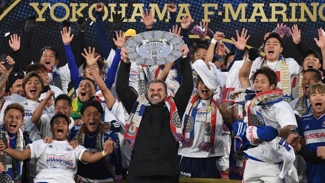 Coach, Ange Postecoglou of Yokohama F.Marinos lifts the J-League champions symbol as they celebrate the win against FC Tokyo at Nissan Stadium on Saturday. Picture: Getty Images