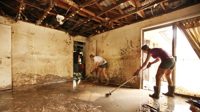Residents of Fig Tree Pocket clean up after the flood.
