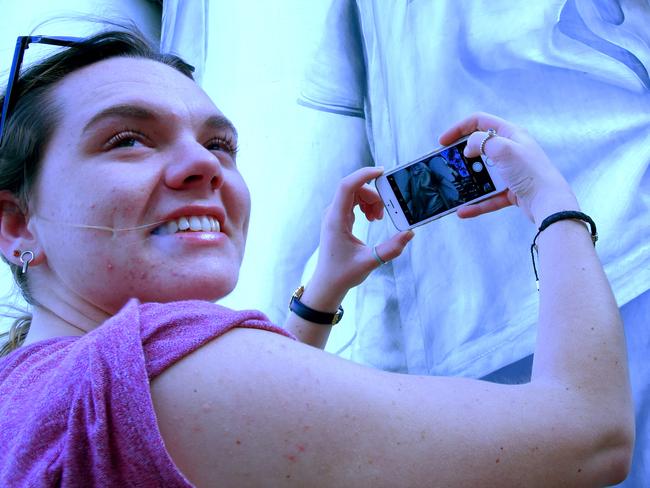 Melbourne woman Emily Kumpis, 22, felt compelled to stop and take pictures of Coonalpyn's silo art on her way home from the AFL preliminary final. Picture: Bernard Humphreys