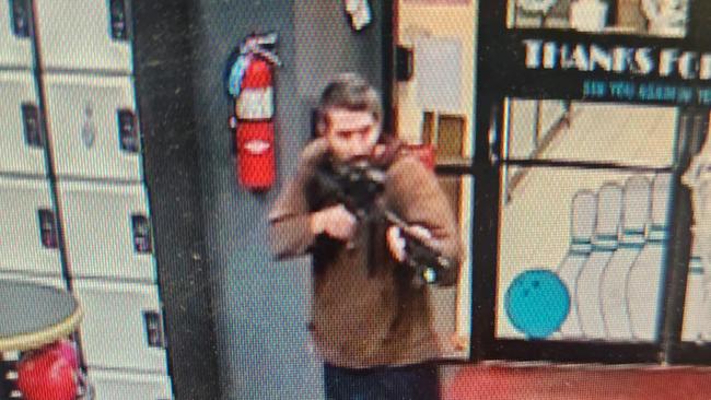 Robert Card aims his semi-automatic rifle in the Lewiston bowling alley on Wednesday. Picture: Androscoggin County Sheriff's via AFP