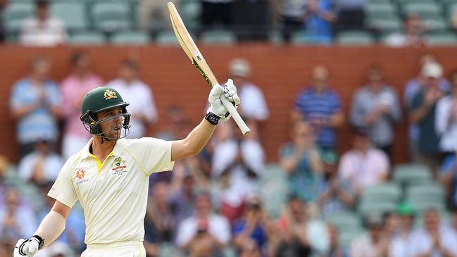 Travis Head raises his bat after scoring his half century on day two. Picture: AAP