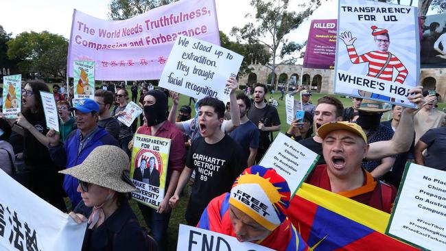 Drew Pavlou, centre, and other University of Queensland students protest against the uni's China-aligned Confucius Institute. Picture: Liam Kidston