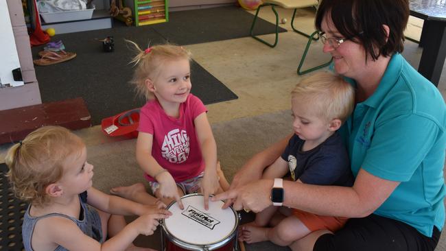 Ms Crawford drumming to music with the children. Photo: Kristen Camp