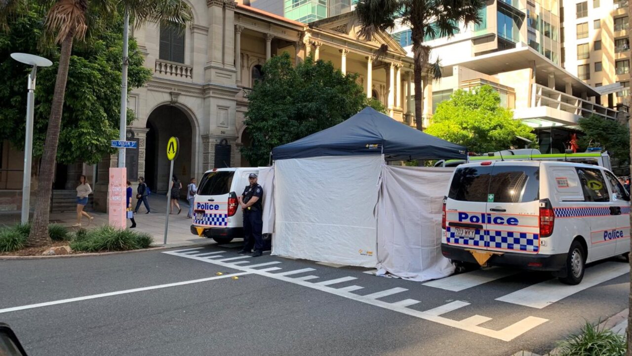 Climate change activists glue themselves to busy Brisbane street