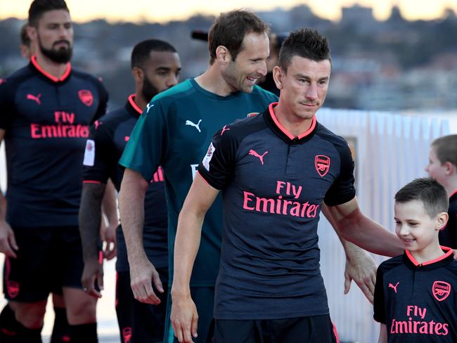 Arsenal players give some young fans a moment to remember at the kit launch.