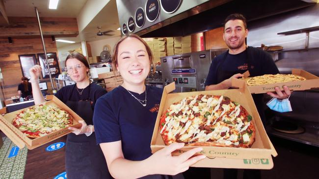 Hayley Clark, Mai Blake and Birtan Tankir celebrate being voted back-to-back best pizzazeria. Picture: Alan Barber