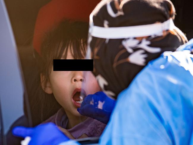 BRISBANE, AUSTRALIA - NewsWire Photos - AUGUST 6, 2021. A young girl is being swabbed at a pop up Covid-19 testing clinic at Eight Miles Plains in Brisbane's south, as Queensland remains in lockdown due to a growing covid cluster.Picture: NCA NewsWire / Dan Peled