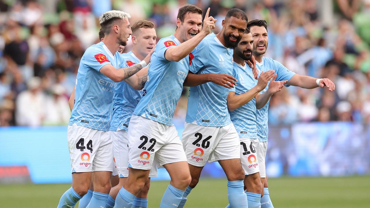 MELBOURNE, AUSTRALIA – DECEMBER 28: Curtis Good of Melbourne City celebrates scoring a goal with team mates during the A-League Men round 10 match between Melbourne City and Brisbane Roar at AAMI Park, on December 28, 2023, in Melbourne, Australia. (Photo by Kelly Defina/Getty Images)