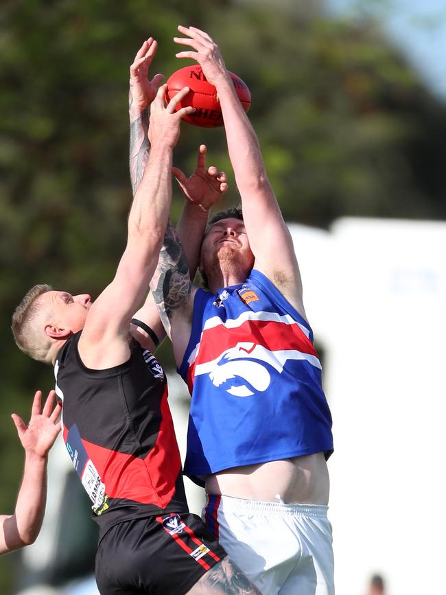 Waaia’s Charlie Burrows and Strathmerton’s Aubrey Coote go hard in the marking contest.