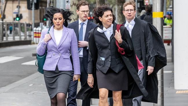 Moira Deeming with Sue Chrysanthou and her legal team. Picture: Jake Nowakowski