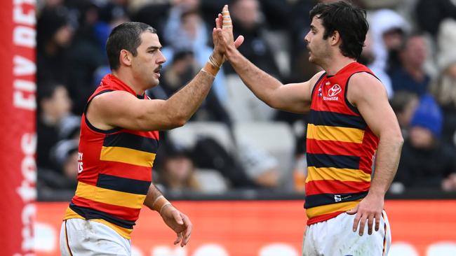 MELBOURNE, AUSTRALIA - JUNE 25: Taylor Walker of the Crows is congratulated by Darcy Fogarty after kicking a goal during the round 15 AFL match between Collingwood Magpies and Adelaide Crows at Melbourne Cricket Ground, on June 25, 2023, in Melbourne, Australia. (Photo by Quinn Rooney/Getty Images)