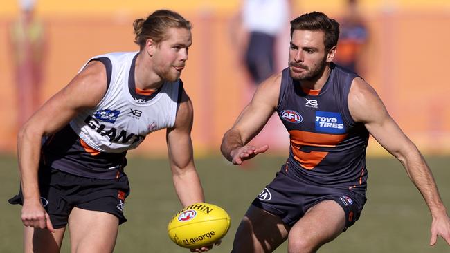 Stephen Coniglio and Harry Himmelberg during GWS Giants training ahead of home game against Hawthorn this weekend. Picture. Phil Hillyard