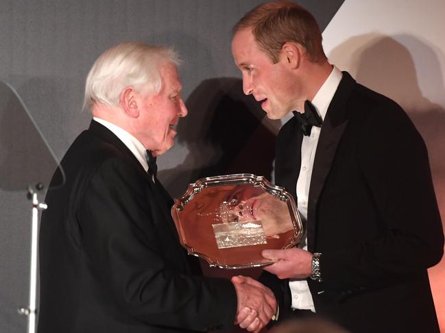 The Duke of Cambridge presenting Sir David Attenborough an award for his services to wildlife during the Tusk Conservation Awards at the Victoria and Albert Museum in London. Picture: Stuart C. Wilson/PA Wire