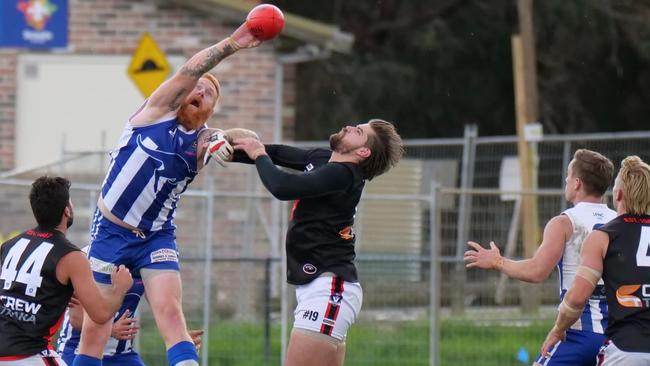 Langwarrin's Matt Naughton and Frankston Bombers' Jack Berry compete in the ruck. Picture: Paul Churcher