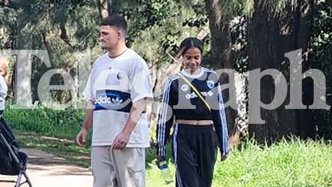 Panthers NRL star Nathan Cleary walks along the Nepean River with Matildas star Mary Fowler. Credit: News Corp