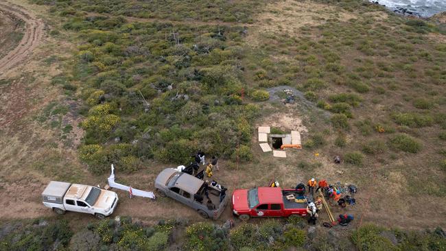 Aerial view showing rescue workers preparing to enter a waterhole where human remains were found near La Bocana Beach. Picture: AFP