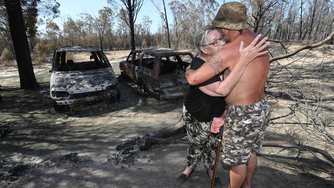 Elizabeth Clarke and Douglas Grist at Cypress Gardens where fires burned. They stayed to save their home and had a Doomsday party. Photo: Annette Dew