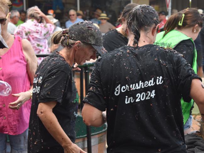 This group from Beaudesert got messy at the Apple and Grape Festival grape crush, 1 March, 2024