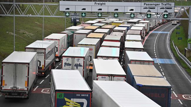 Freight lorries queue at the entrance to the Channel Tunnel Freight terminal at Folkestone in England. Picture: AFP