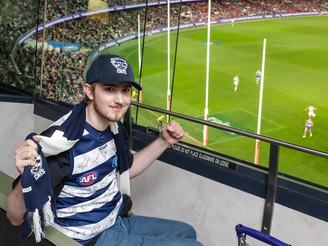 Angus Dennis-Hewett, 17, is supported by two artificial hearts on Koala ward at the Royal Children's Hospital, he will be leaving the hospital for the first time in 2 years to see his beloved footy team Geelong play against the Western Bulldogs at Marvel Stadium. Picture: Ian Currie