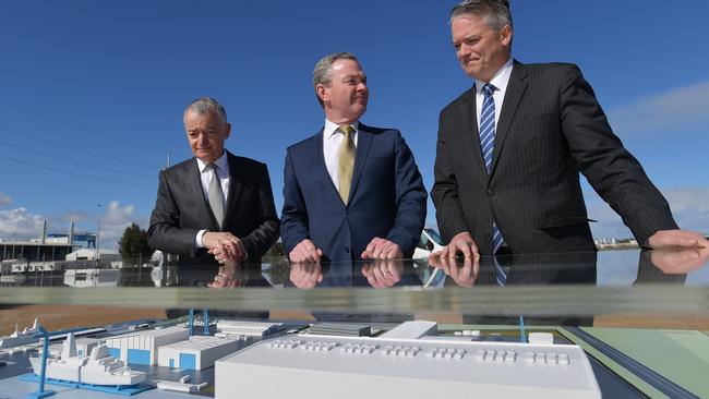 ANI chairman Lucio Di Bartolomeo, federal defence industry minister Christopher Pyne and federal finance minister Mathias Cormann reveal the final design of a major expansion of the naval shipbuilding precinct in Adelaide. Picture: AAP/David Mariuz