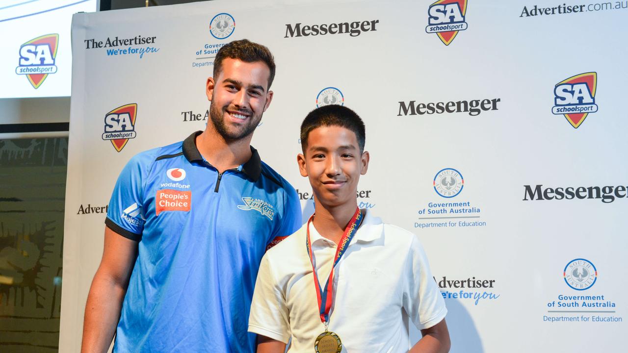 Cricketer Wes Agar with runner up Khai Tran from North Adelaide Primary School at The School Sports Awards at the SA Museum. Picture: Brenton Edwards