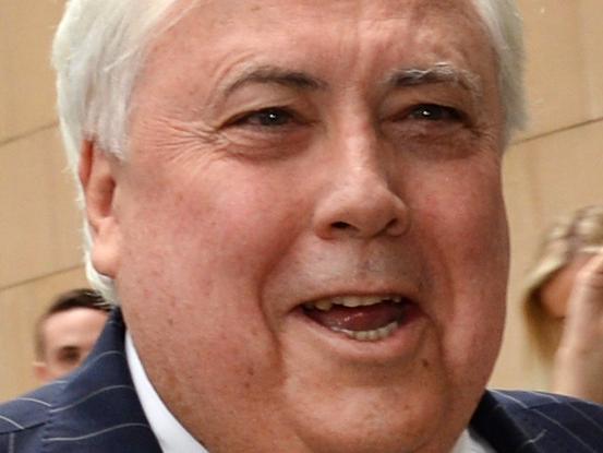 Businessman Clive Palmer, flanked by security guards, arrives at the Federal Court in Brisbane, Thursday, Sept. 15, 2016. The former federal MP will continue to give evidence under oath about the demise of Queensland Nickel, which was put into liquidation earlier this year. (AAP Image/Dan Peled) NO ARCHIVING