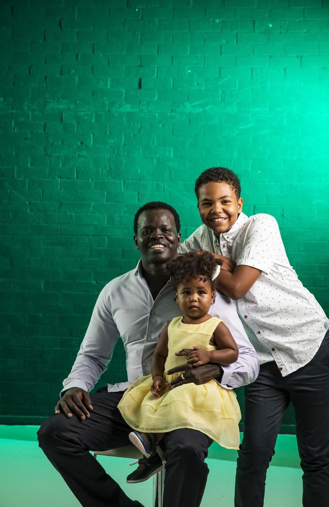 Former child soldier Ayik Chut with his two children. Picture: Mark Cranitch