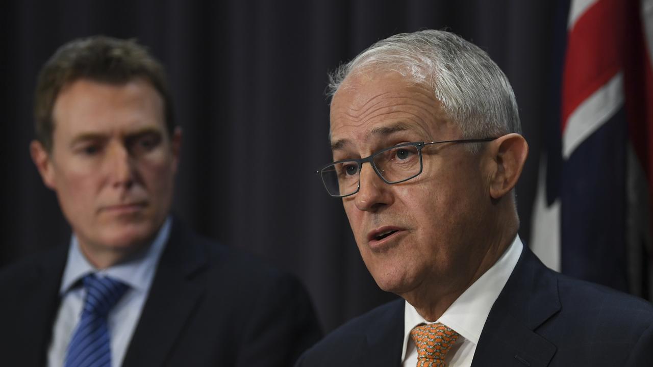 Former Australian Prime Minister Malcolm Turnbull speaks as Australian Attorney-General Christian Porter looks on in 2018.