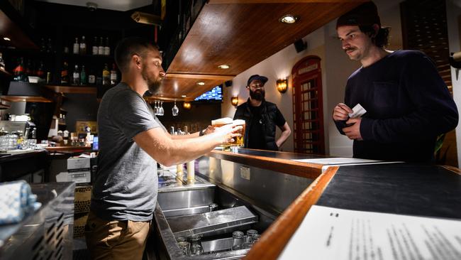 A round of drinks at The Woolpack Hotel in Sydney’s Redfern on Monday. Picture: AAP