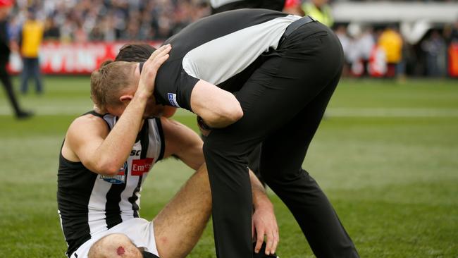 Collingwood coach Nathan Buckley consoles Brodie Grundy after the 2018 AFL Grand Final. Picture: Getty Images