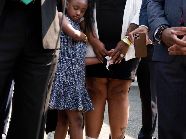 George Floyd's daughter Gianna (C) looks on as members of her father’s family speak outside the White House after meeting with US President Joe Biden. Picture: AFP