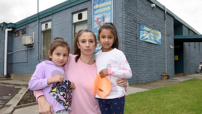 Bulleen mum Natalie Maharaj with her daughters Aurora, 4, and Allegra, 6, at the local swim centre, which is set to make may for the North East Link. Picture: Tony Gough