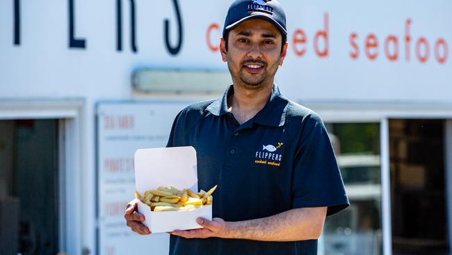 Flippers Cooked Seafood are finding ways around the potato shortage. Manish Acharya works at Flippers. Picture: Linda Higginson