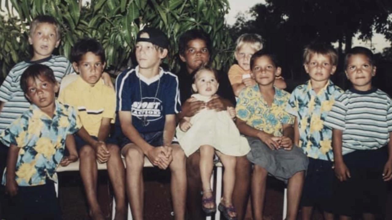Crow Shane McAdam (third from left), Gold Coast's Jy Farrar (fourth from right), Collingwood's Ash Johnson (second from right) and Carlton’s Sam Petrevski-Seton (far right) in their home town of Halls Creek, WA as children.
