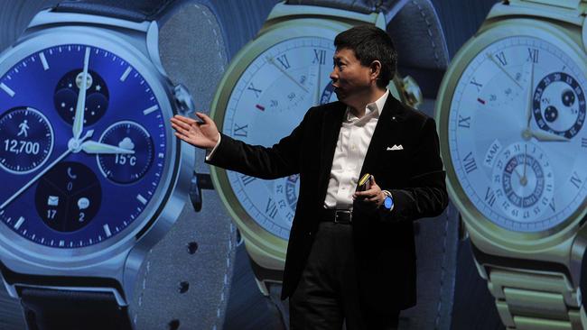 Huawei's Consumer Business Group Chief Executive Officer (CEO) Richard Yu presents his company's new device "Huawei Watch" during a press conference in Barcelona on March 1, 2015 the eve of the 2015 Mobile World Congress opening. Phone makers will seek to seduce new buyers with even smarter Internet-connected watches and other wireless gadgets as they wrestle for dominance at the world's biggest mobile fair starting tomorrow. AFP PHOTO / JOSEP LAGO