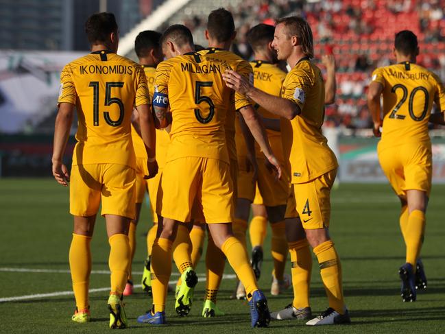 Apostolos Giannou (hidden) celebrates with teammates after scoring.